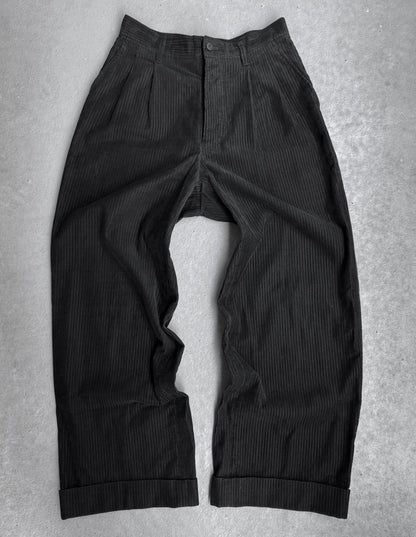 Black ribbed pants on a gray background