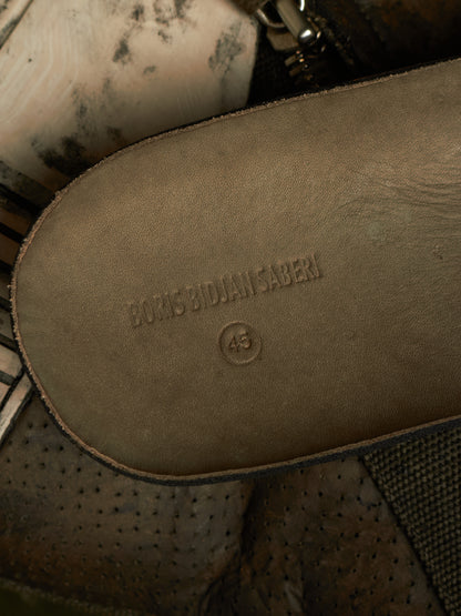 Close-up of the sole of a brown leather shoe or boot, embossed with the brand name 'BORIS BIODAN SABEN' and size '43'.