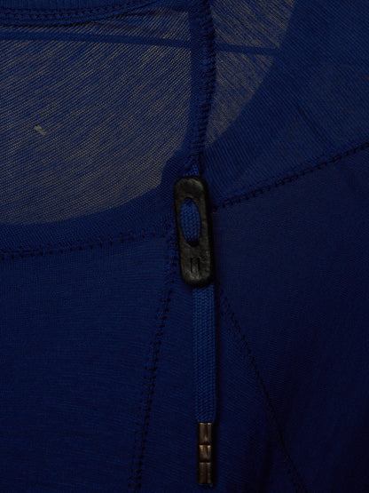 Close-up of a royal blue knit garment with a central zipper and dark zipper pull.
