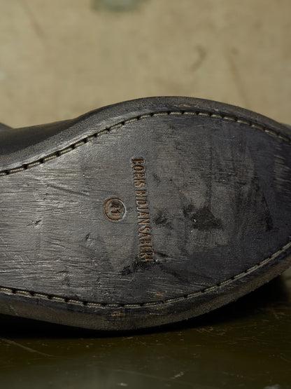 Close-up of the sole of a dark brown leather shoe, showing the brand name 'BOES MULLER' stamped in the center.