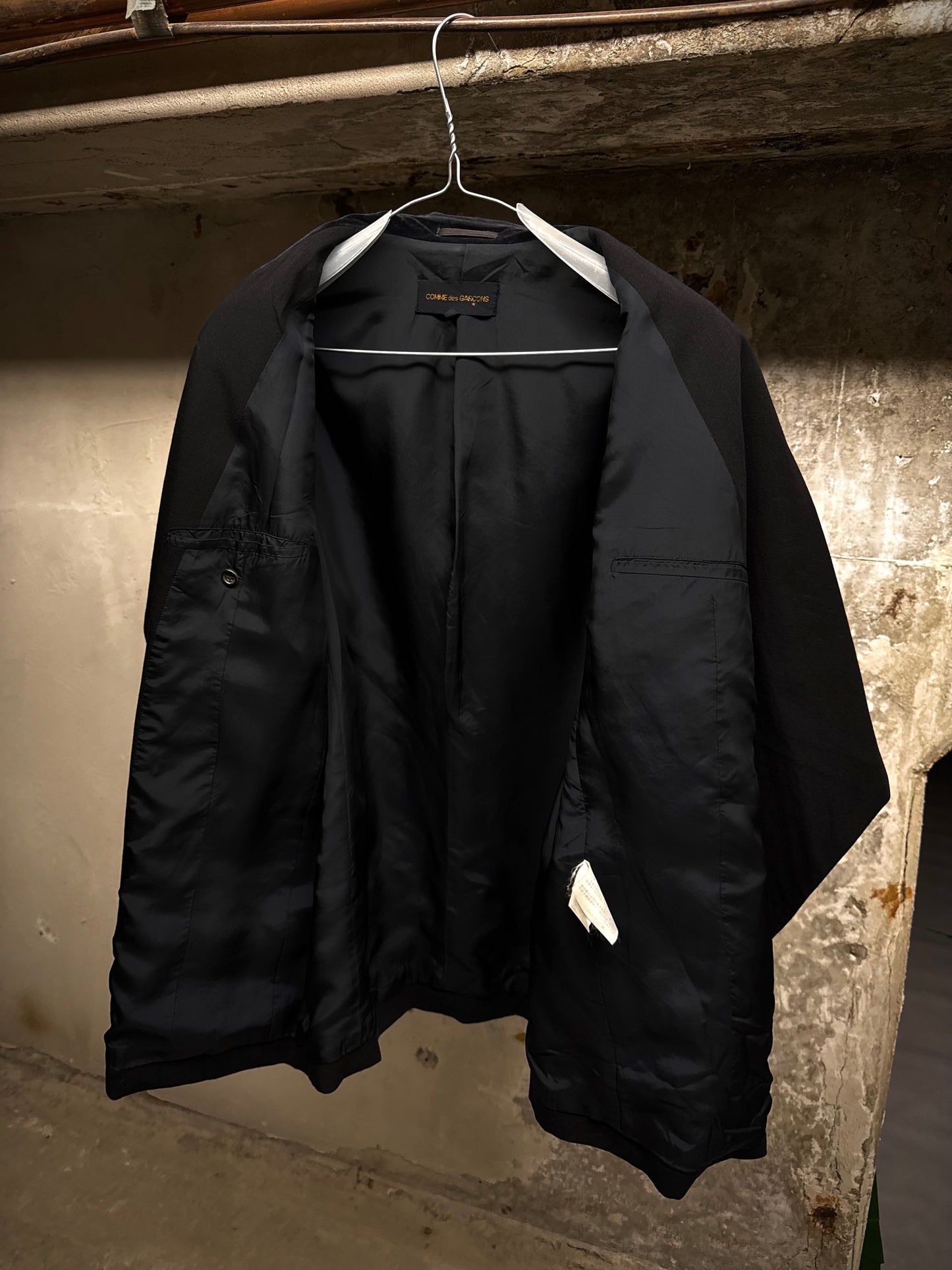 COMME des GARÇONS Late 80s 'Jean Paul Gaultier' Woven Tag Asymmetric Open-front Blazer detail | DRIEW GARMENTS