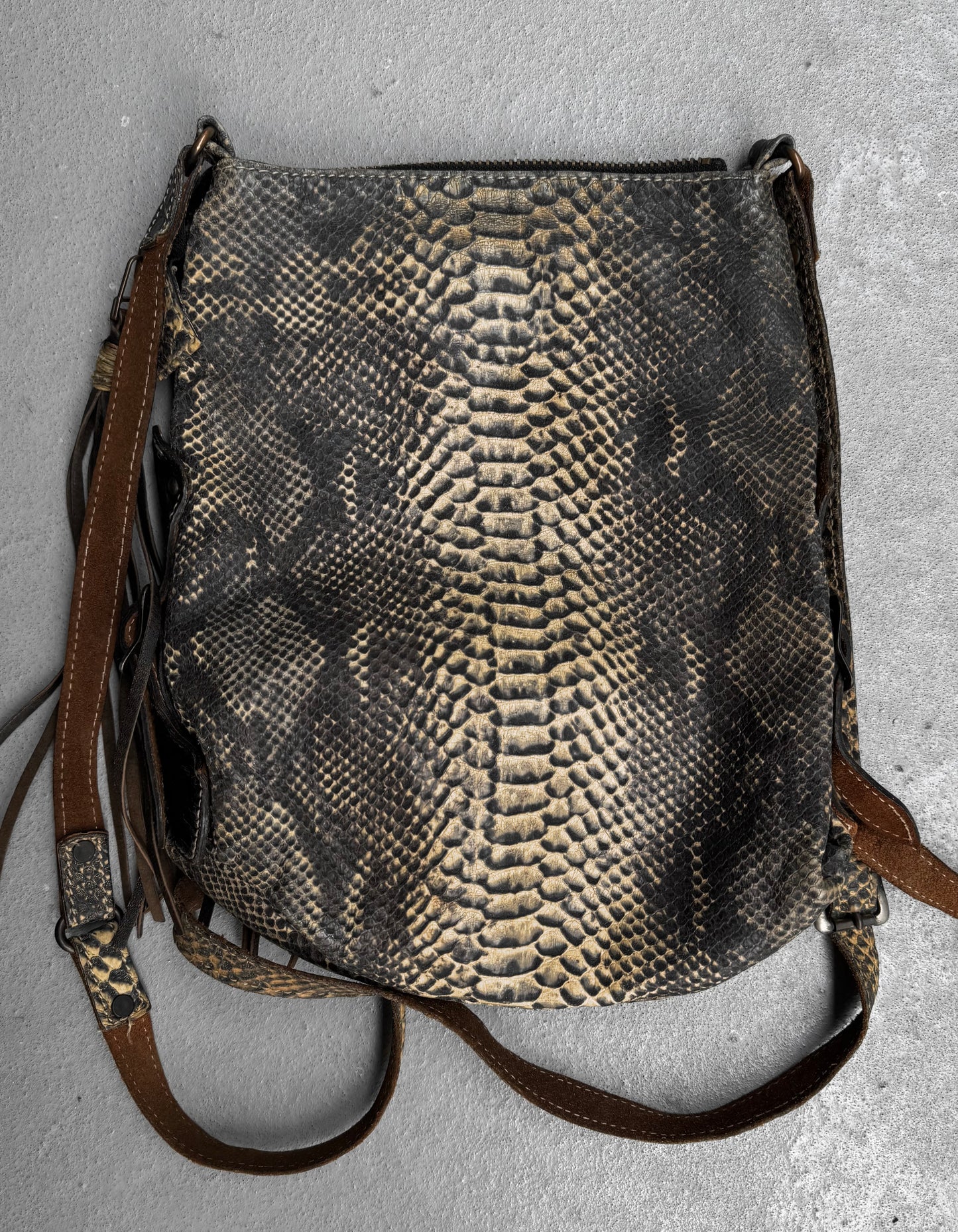 A Kyoji Maruyama Early 00s yellow crocodile-embossed leather side bag with dark brown leather straps, lying flat on a gray surface.