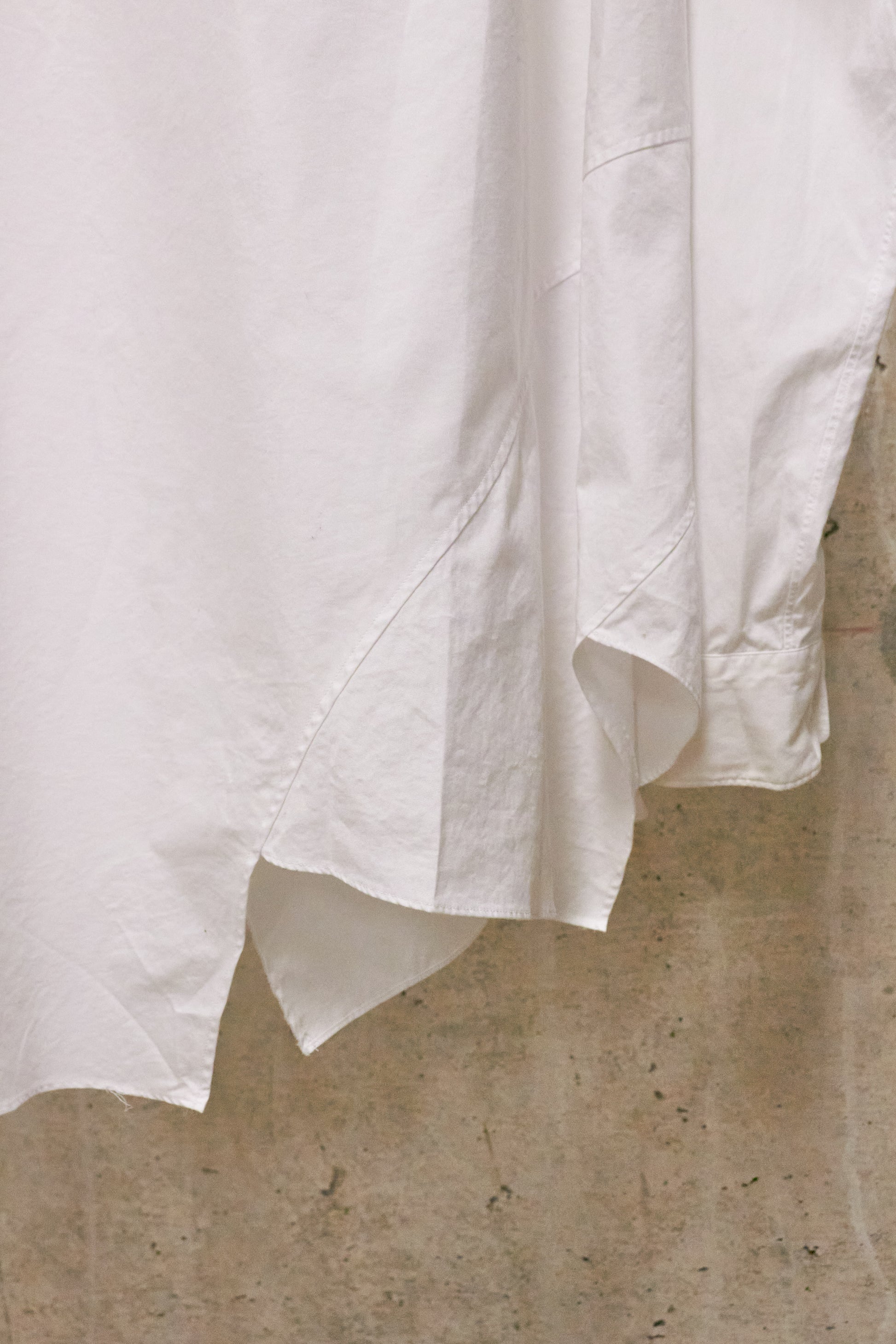 White fabric draped over a textured surface