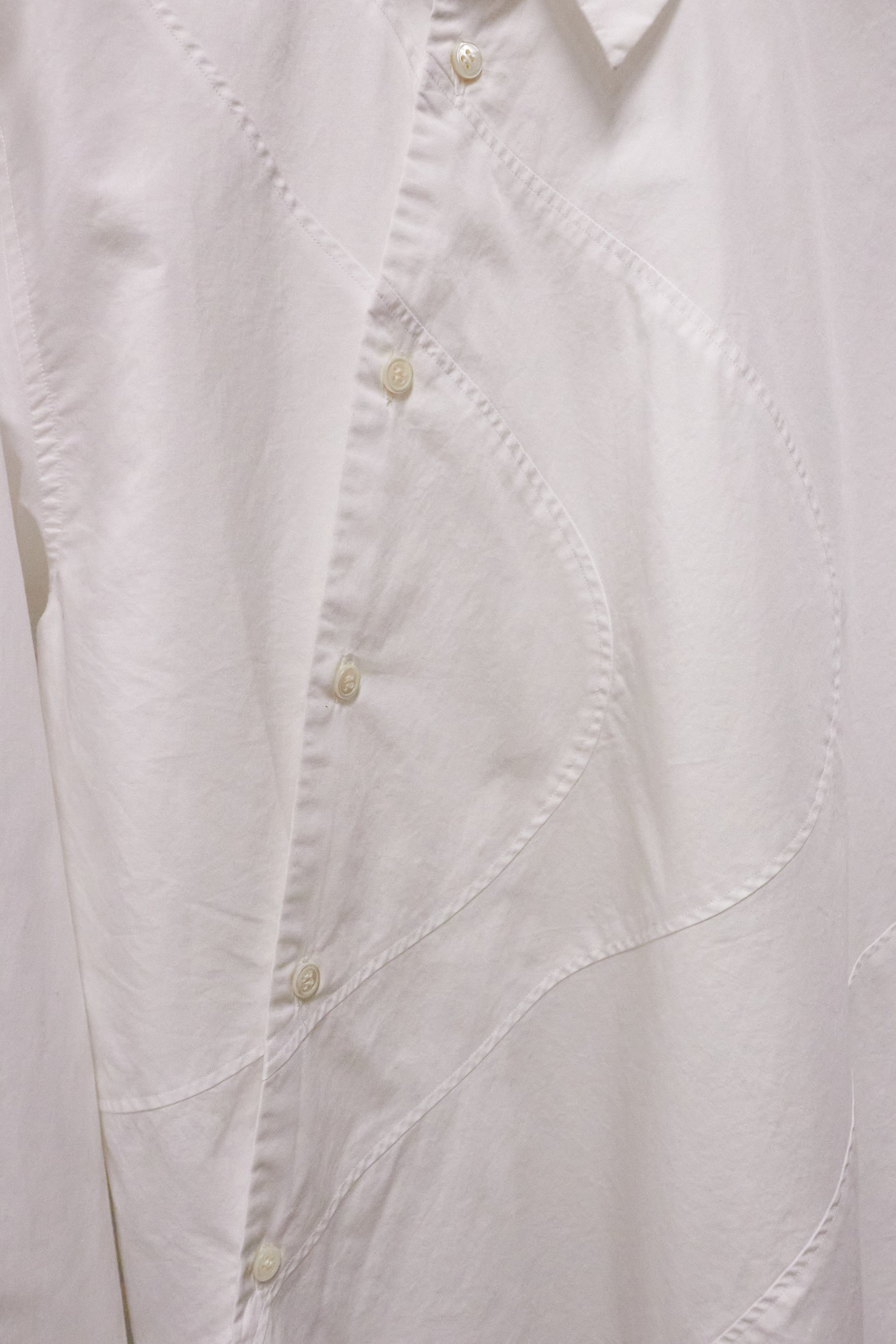 Close-up of a white shirt with button details