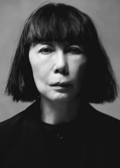 Rei Kawakubo portrait black & white - founder of avant-garde clothing brand COMME des Garcons