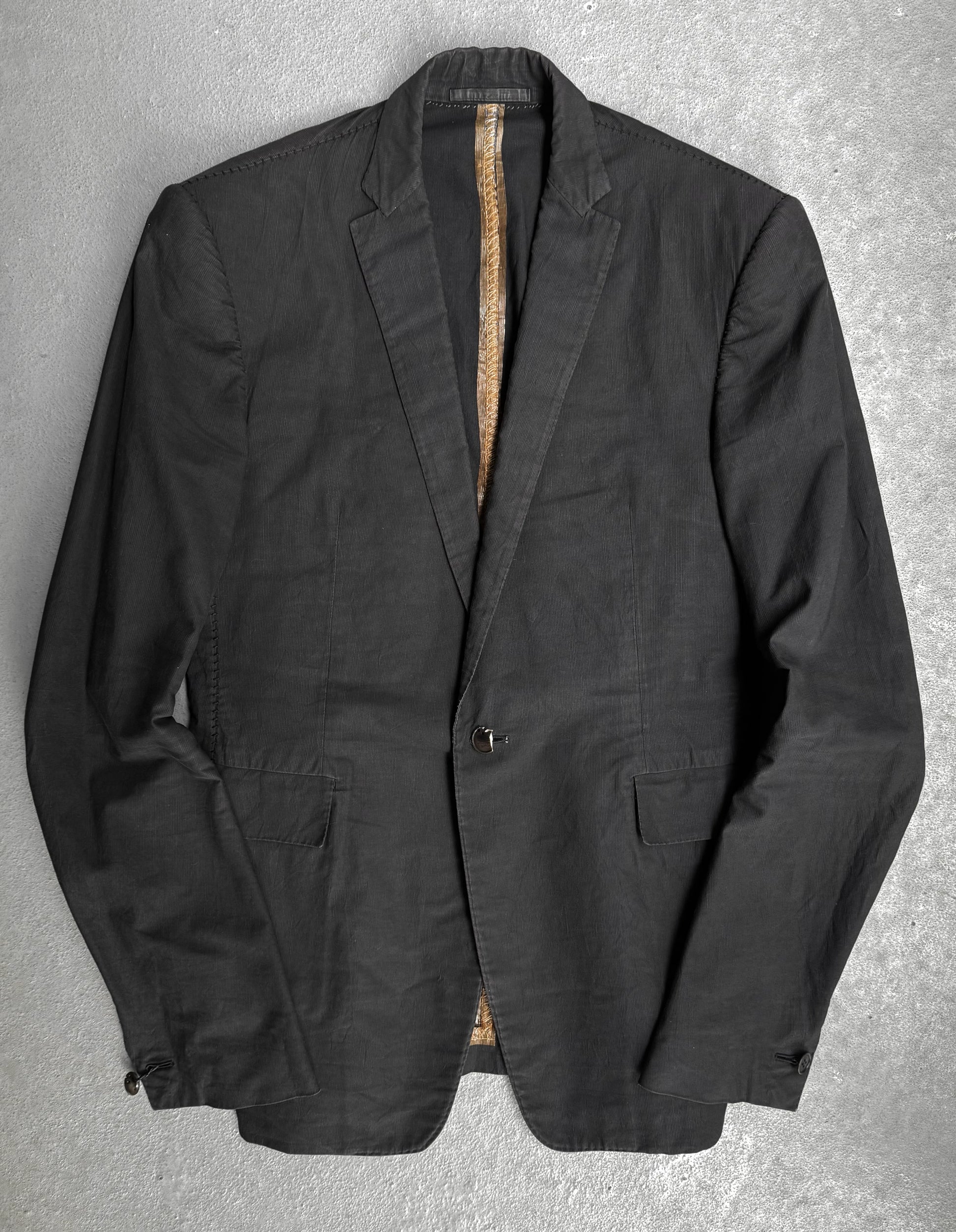 Black jacket on a textured gray background