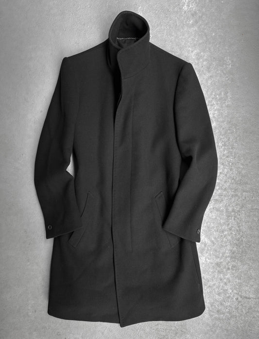 Black coat on a textured gray background