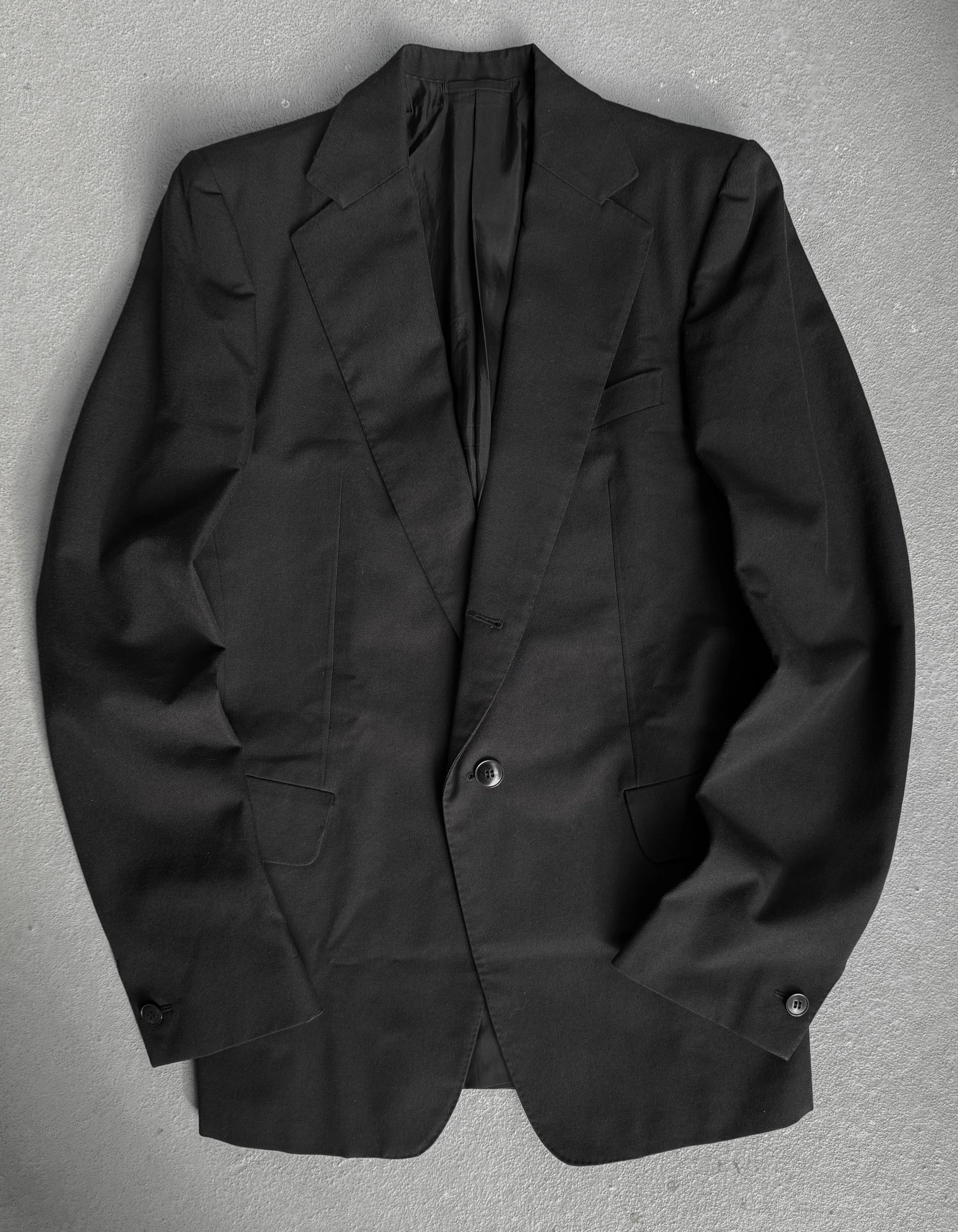Black blazer on a gray background
