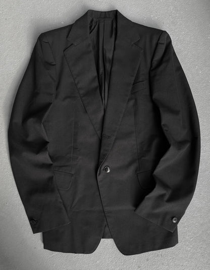 Black blazer on a gray background