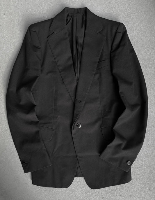 Black blazer on a gray background