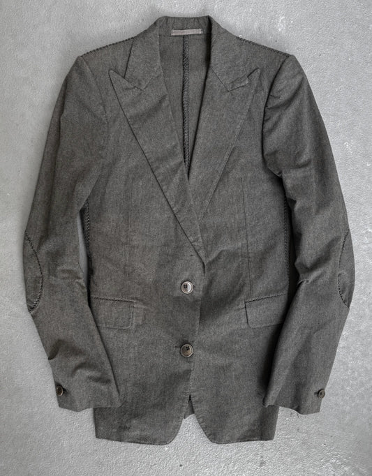Gray blazer on a textured gray background