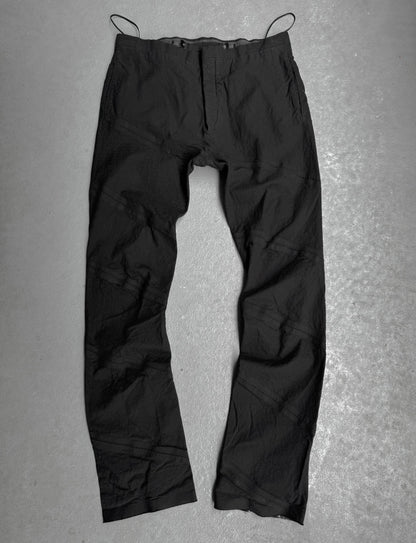 Black pants on a gray textured background