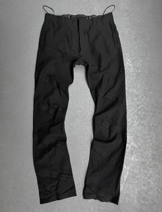 Black pants on a gray textured background