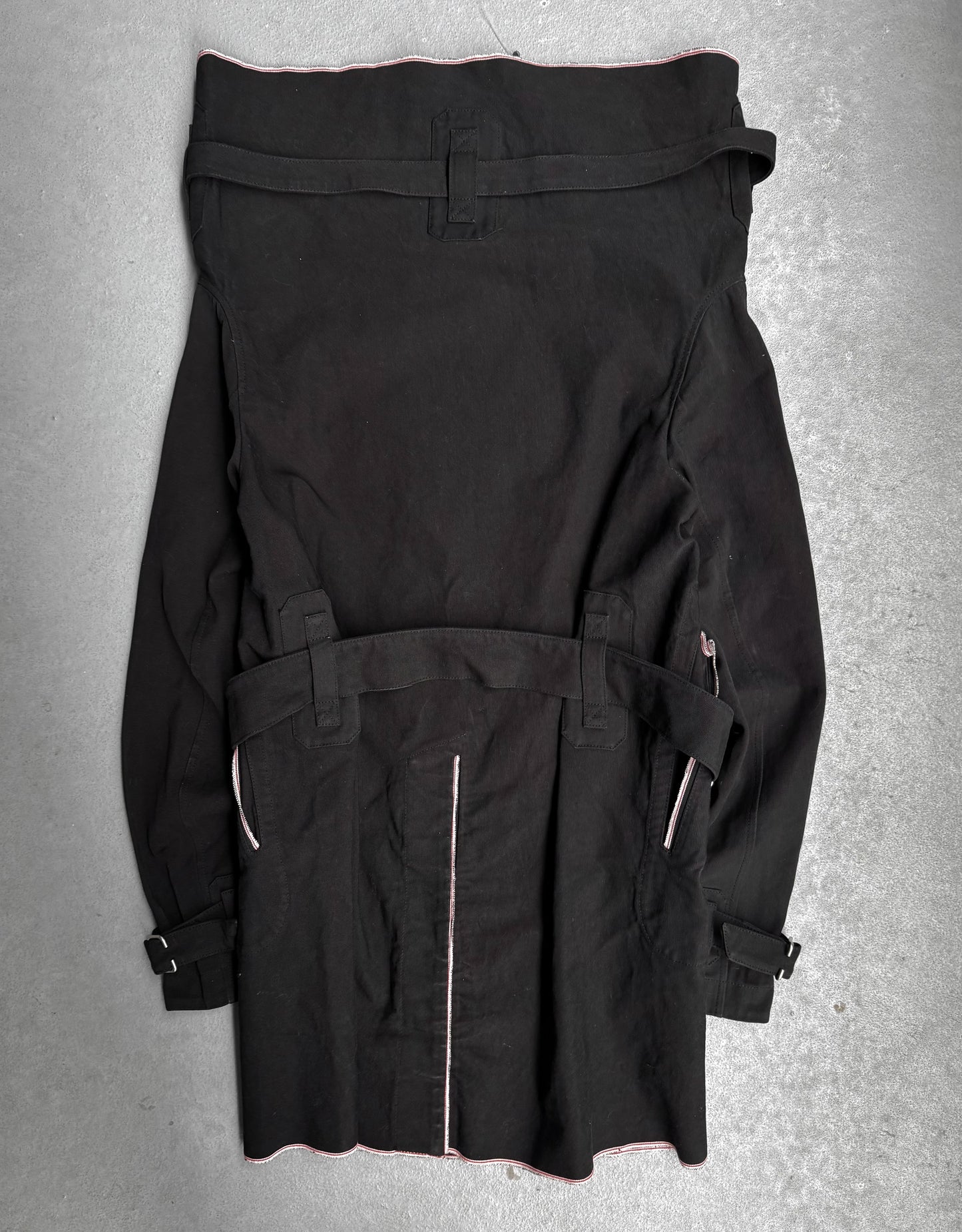 Black jacket with zippers on a gray background