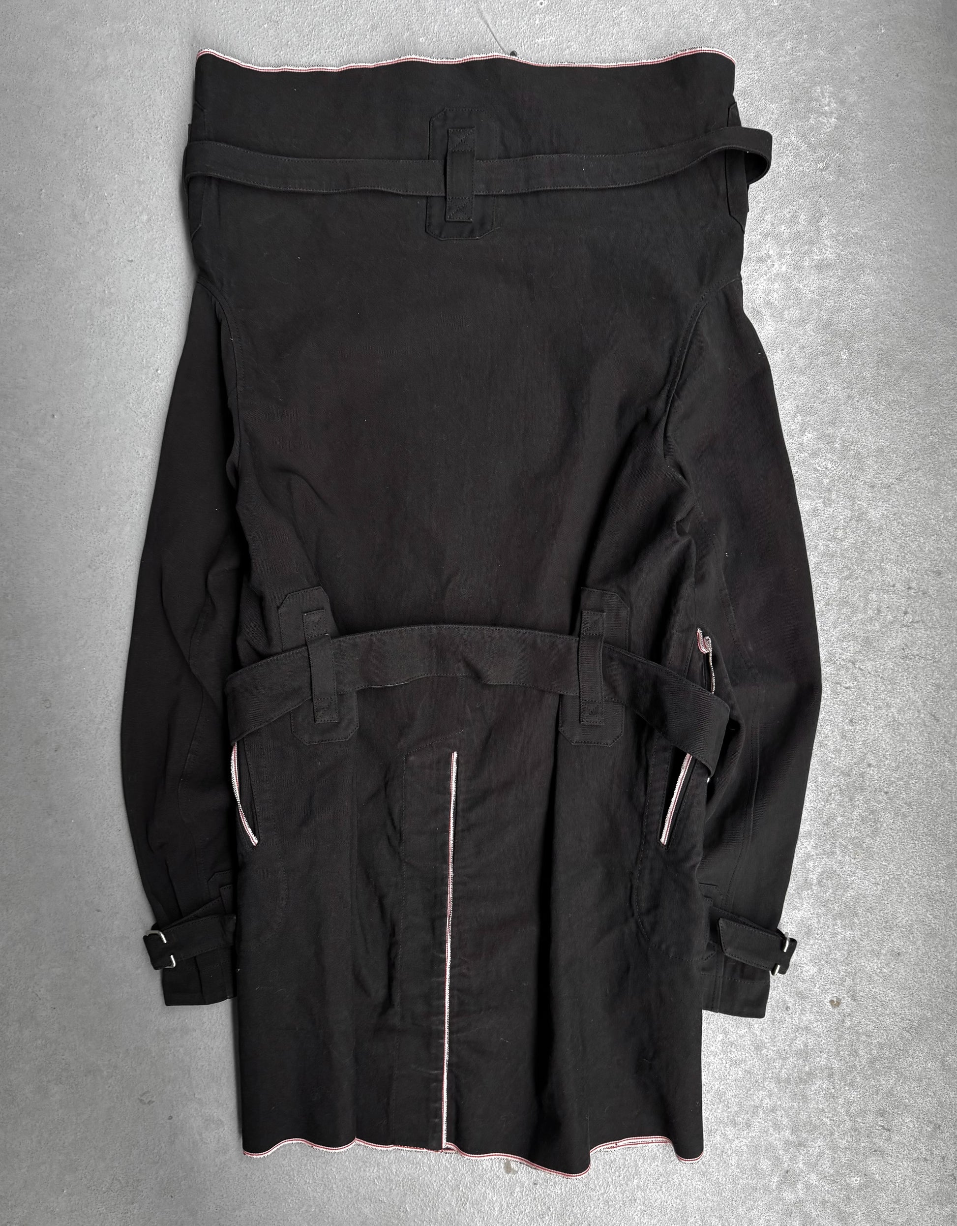 Black jacket with zippers on a gray background
