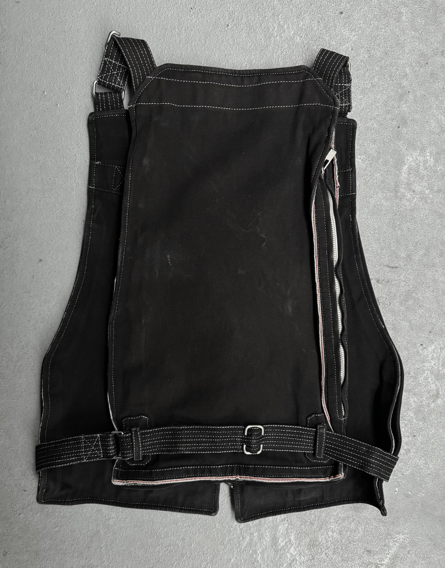 Black leather apron on a gray surface