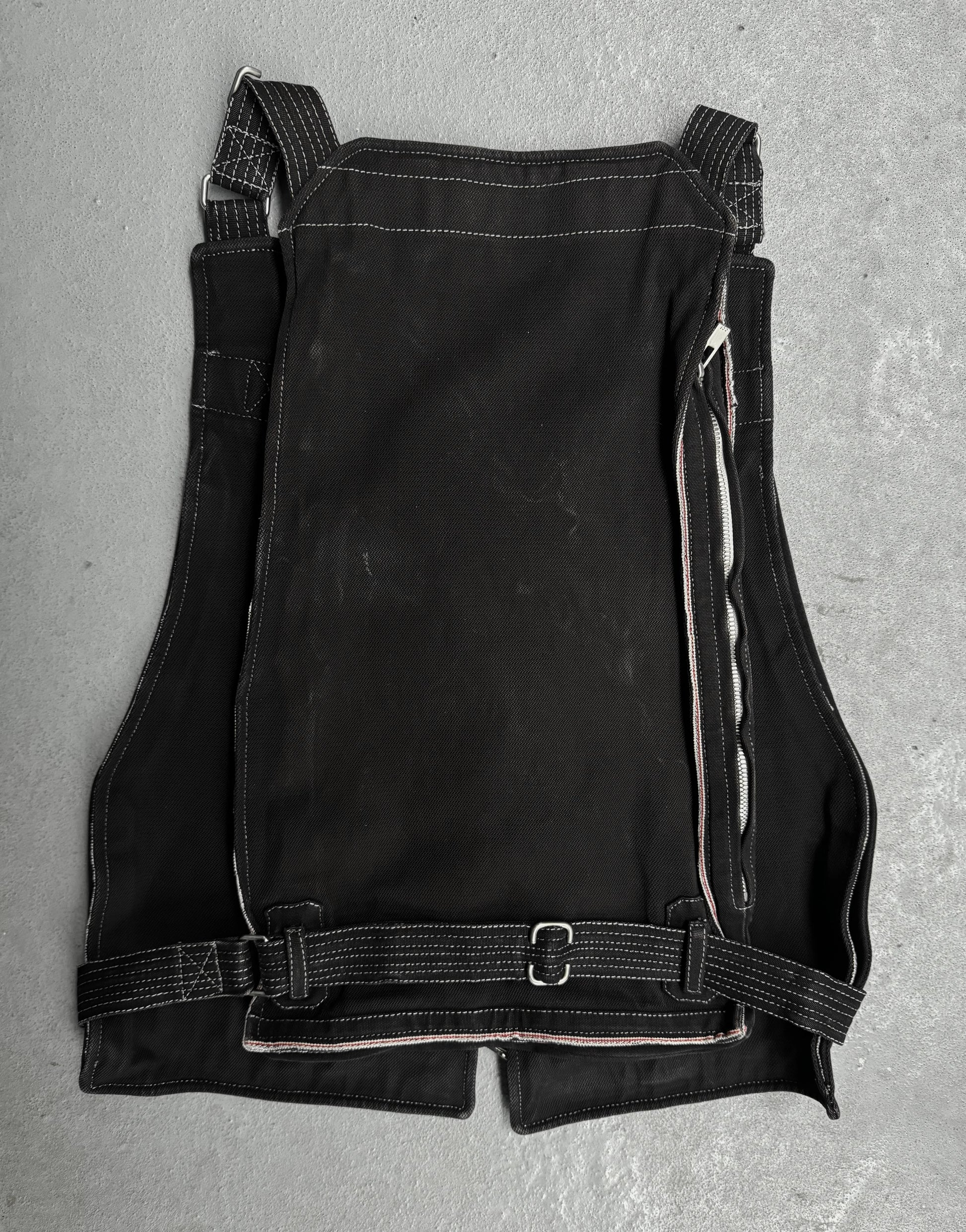 Black leather apron on a gray surface