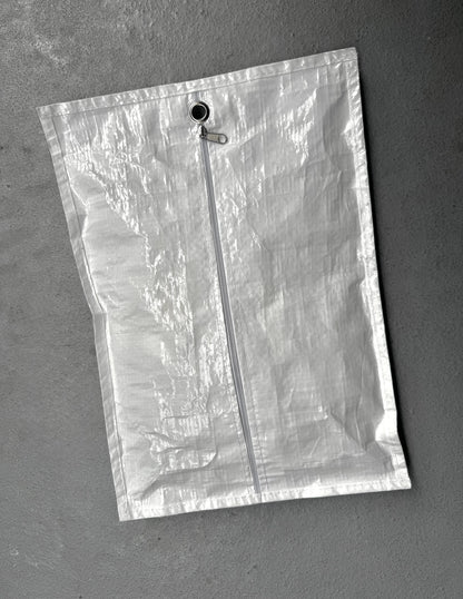Clear plastic bag with a zipper on a gray background