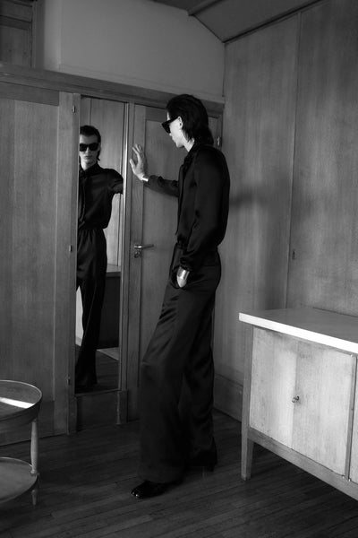 Celine Promotional Material Fall 2022 Menswear Model looking into mirror  