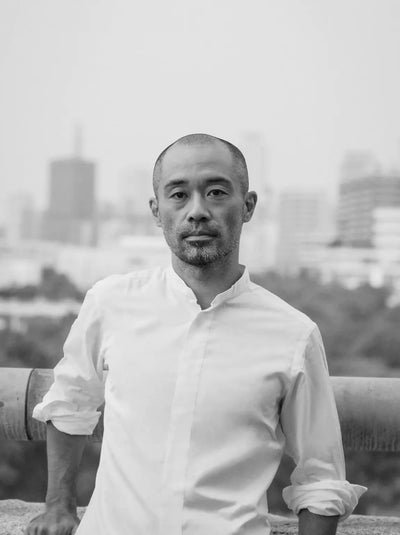 Daisuke Iwanaga portrait in black and white — founder of Cornelian Taurus, Japanese handcrafted leather bags label.