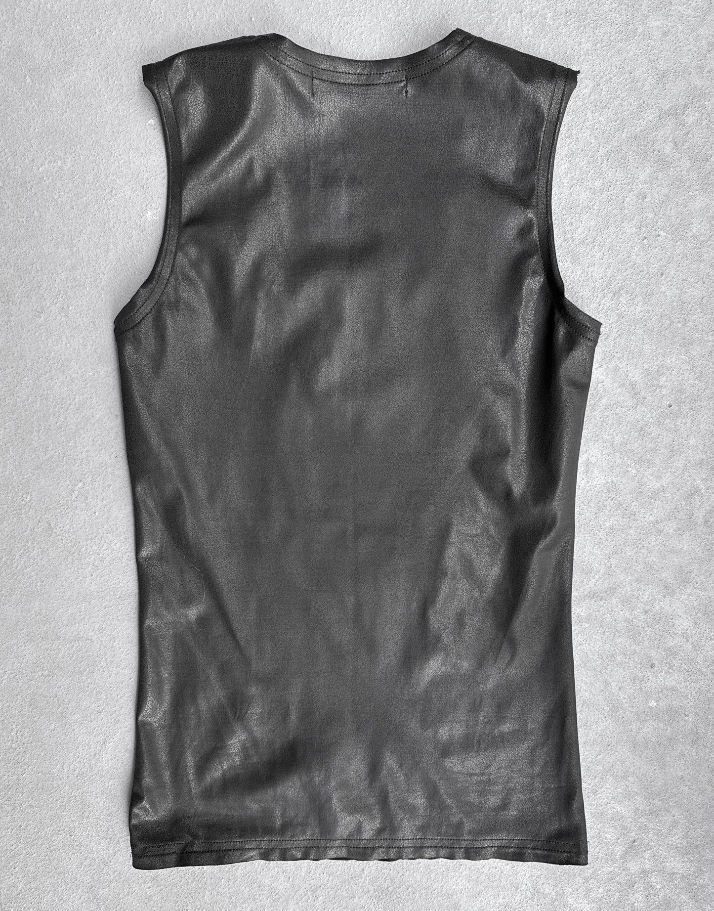 A Junya Watanabe SS23 waxed scoop-neck tank top in black, size S and slim fit, is displayed in flawless condition laid flat on a light gray textured surface, showing the back.