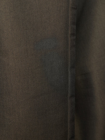 Close-up of a dark brown textured fabric with a visible vertical seam.
