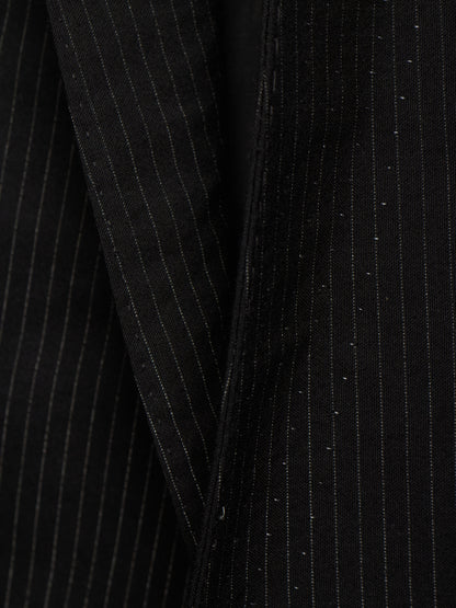 Close-up of a black pinstripe fabric, showing fine vertical white stripes and subtle shimmering details.