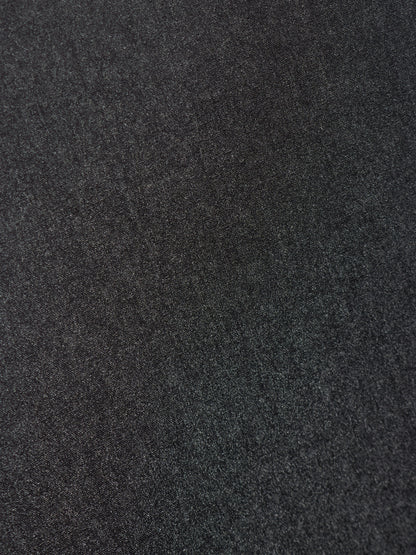 A close-up texture shot of a dark charcoal gray felt or wool fabric.
