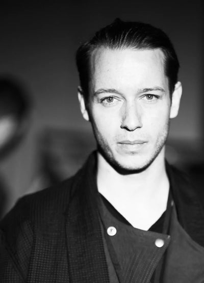 Damir Doma portrait in black and white — minimalist avant-garde clothing designer