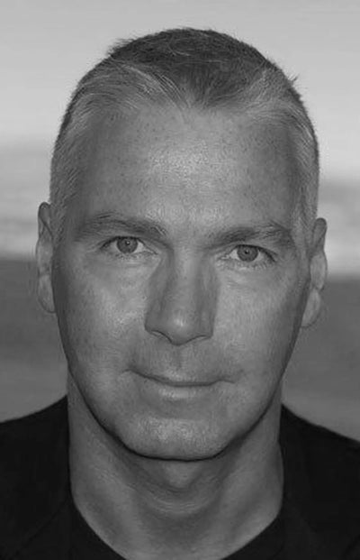 Dirk Bikkembergs portrait in black and white — designer known for athletic, military-influenced clothing