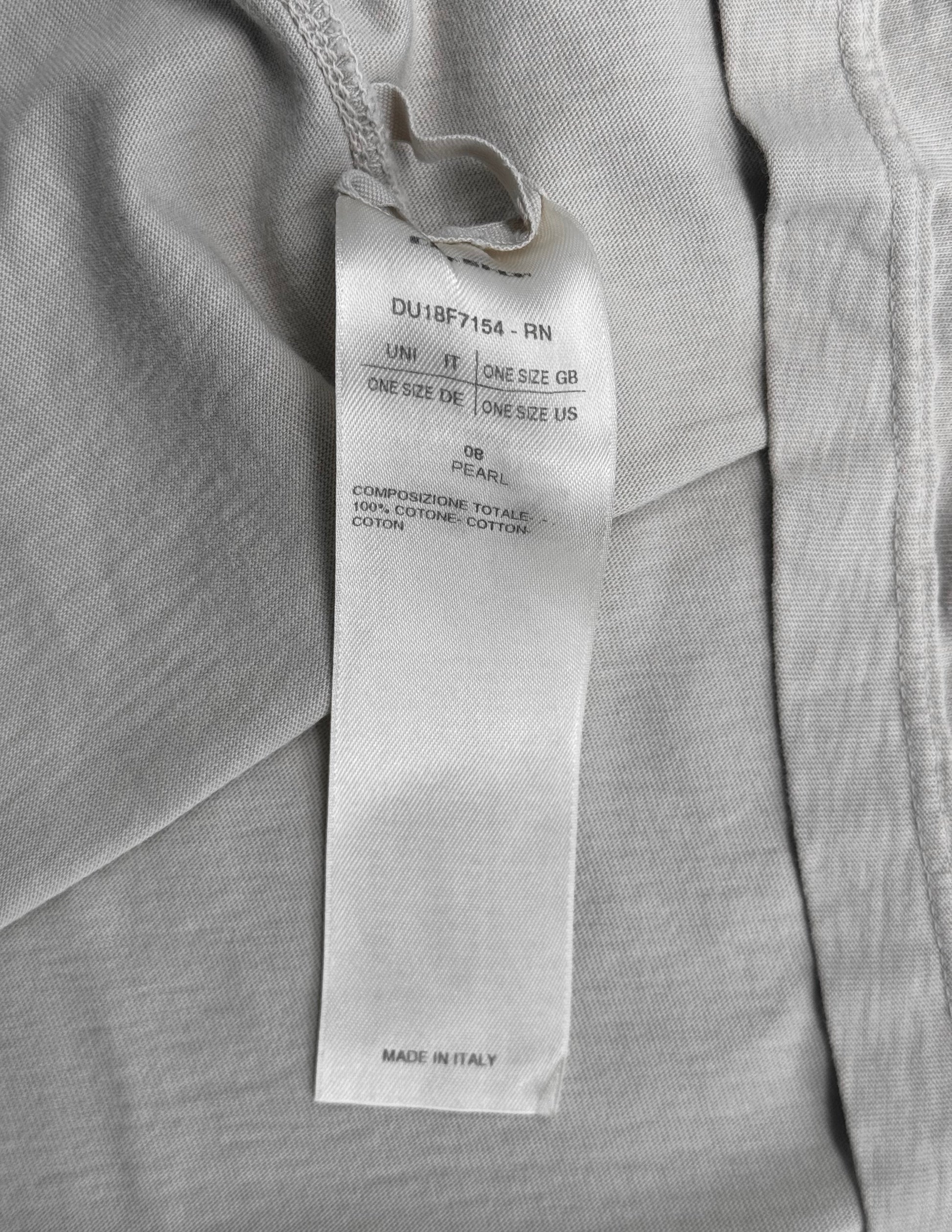 A white tag on light gray fabric from the Rick Owens DRKSHDW AW18 “SISYPHUS” Pearl Racer Tank Top shows one size for various regions, 100% cotton material, and indicates it was made in Italy.