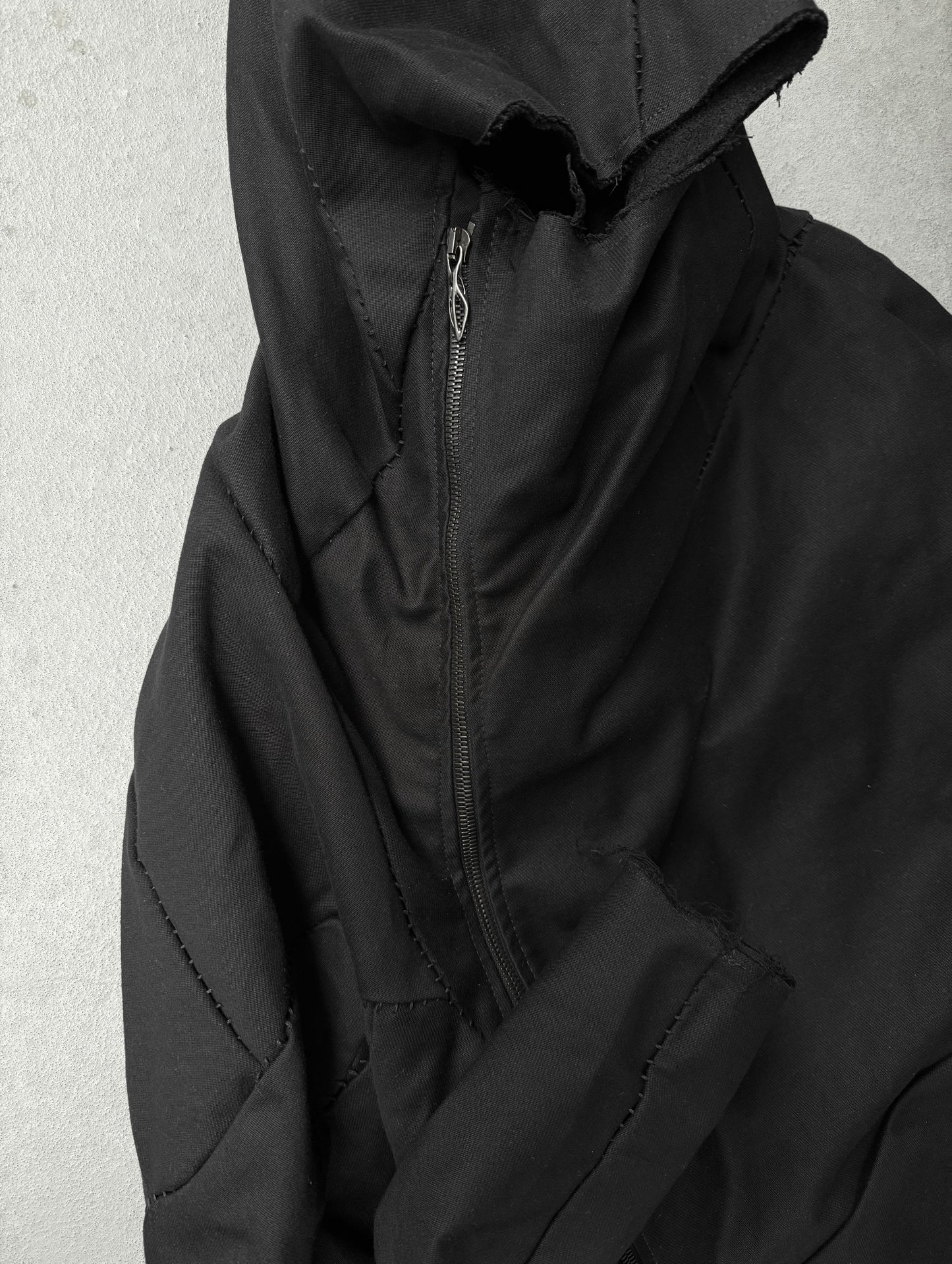 LEON EMANUEL BLANCK Distortion Curved Overlock Wool Lined Hooded Coat detail | DRIEW GARMENTS