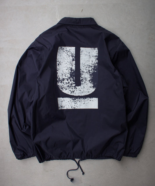 Undercover SS10 Navy ‘Cracked’ Logo Coach Jacket
