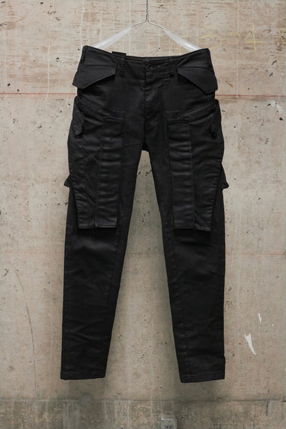 Black cargo pants on a textured beige background