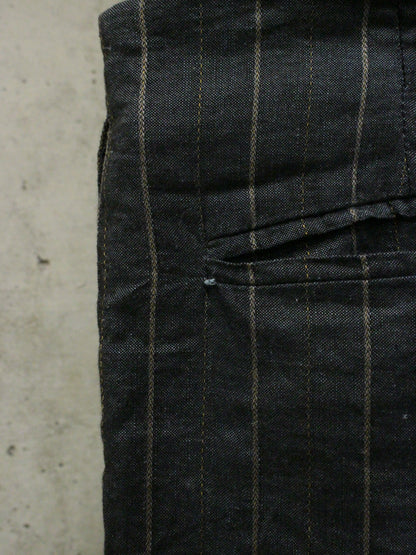 Black checkered pants on a concrete surface