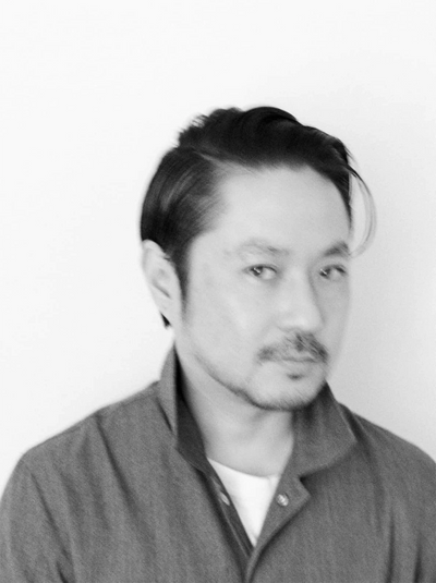 Black and white close‑up portrait of Fumito Ganryu, Japanese fashion designer and founder of the GANRYU label