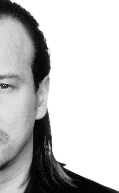 Helmut Lang black and white portrait — pioneering minimalist clothing designer