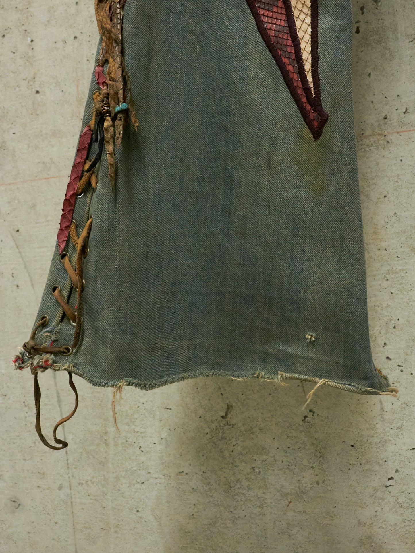 Textile with embroidered details on a textured surface
