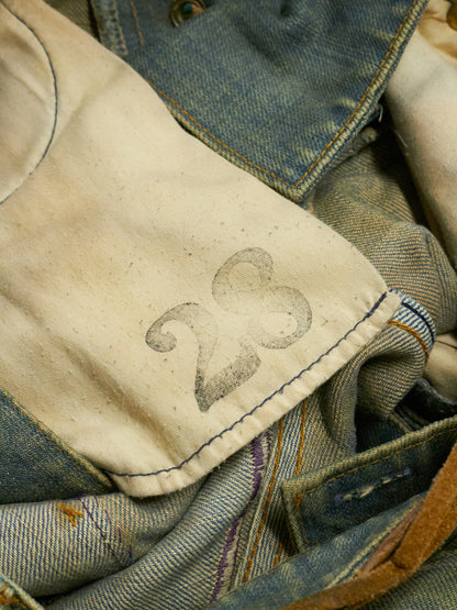 Close-up of denim fabric with number 23 embroidery