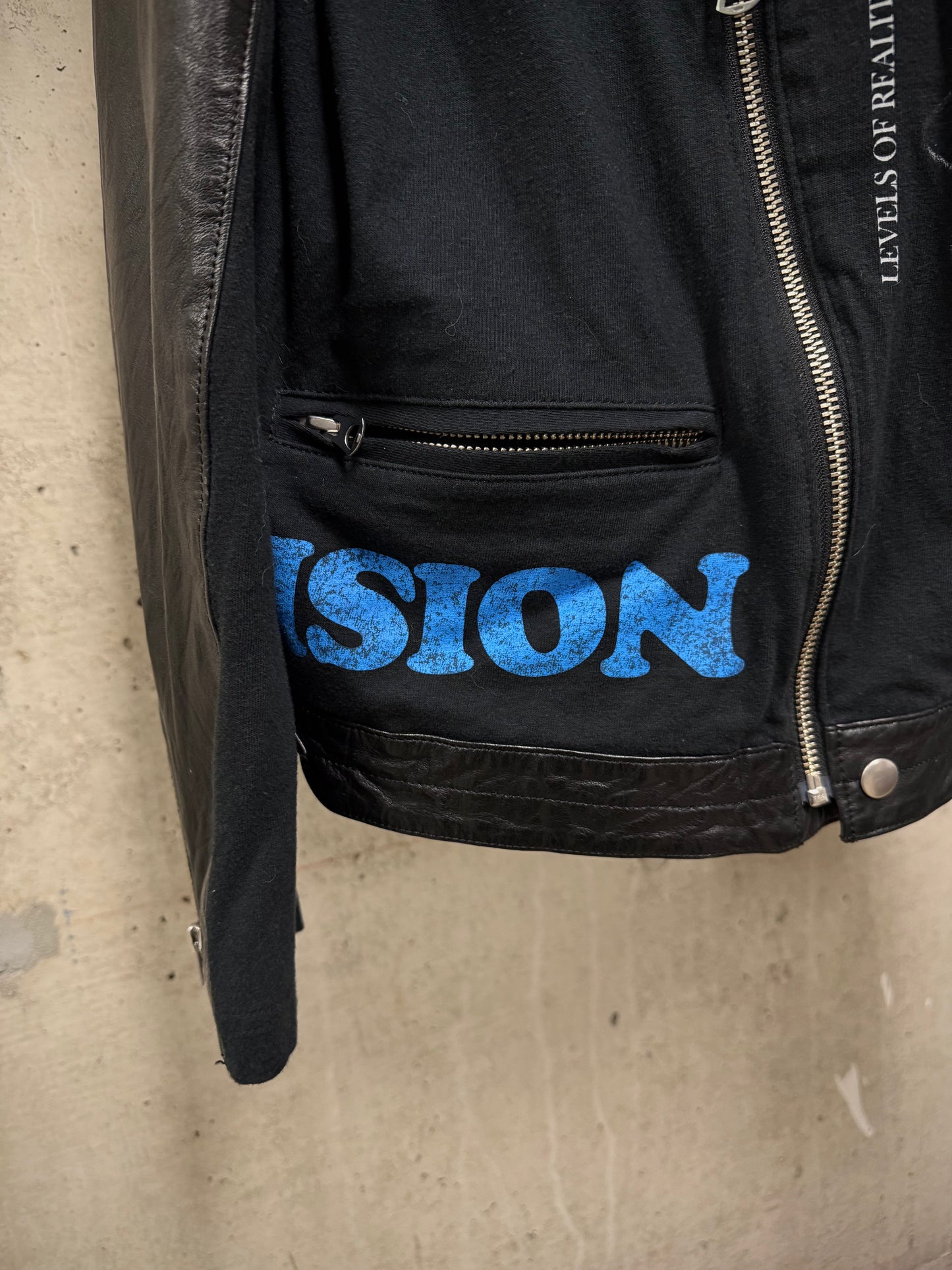 UNDERCOVER SS22 “Once in a Lifetime” Graphic Printed Hybrid Jersey Leather Perfecto Jacket