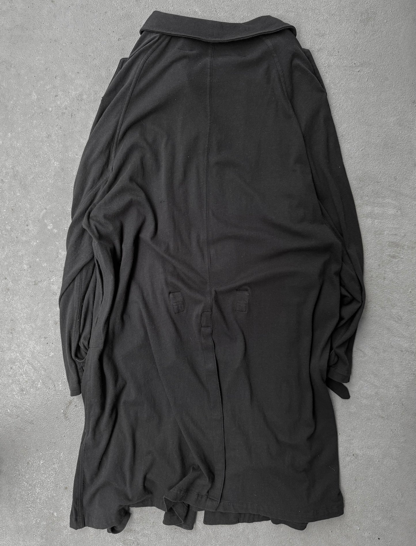 Black shirt on a gray textured surface