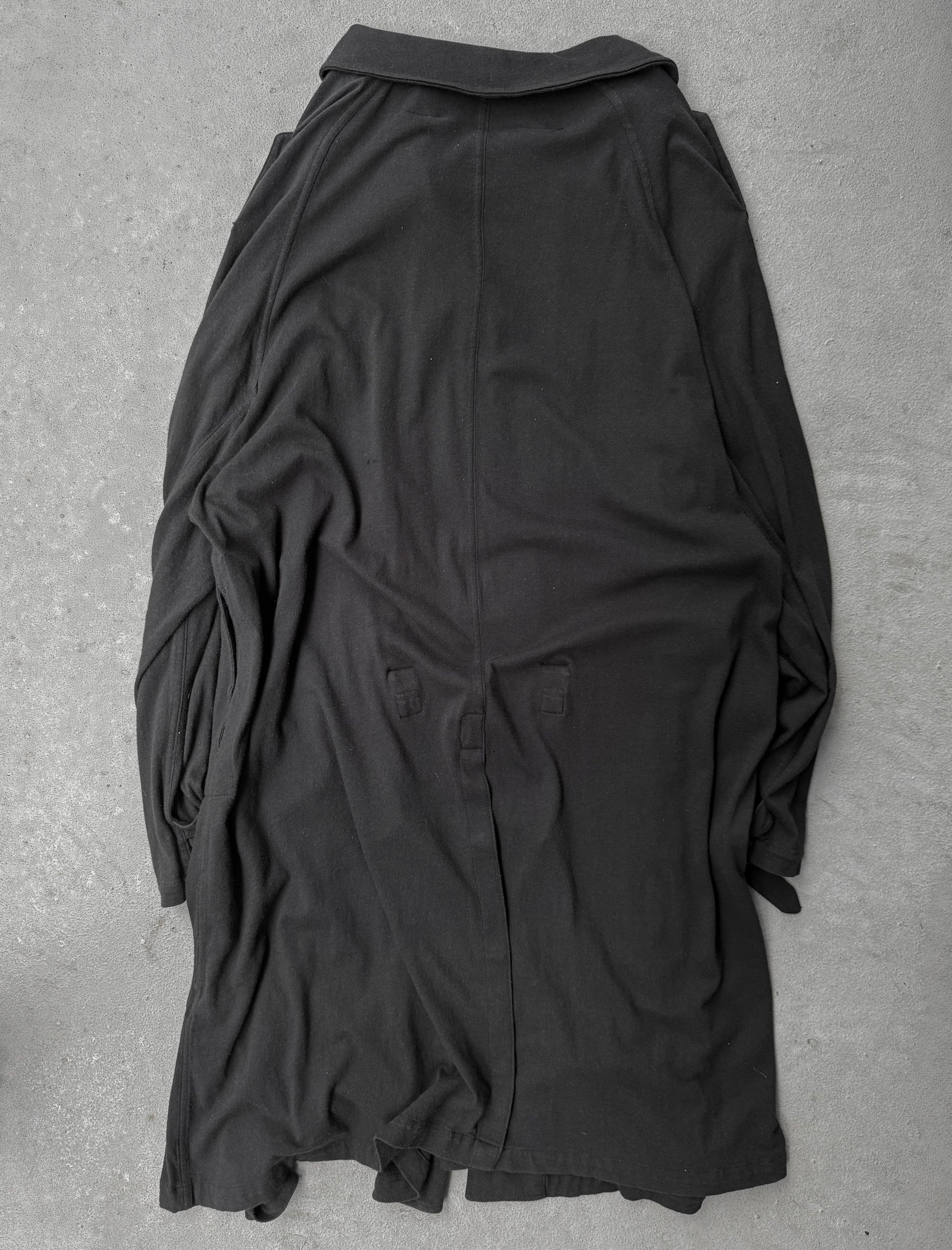 Black shirt on a gray textured surface