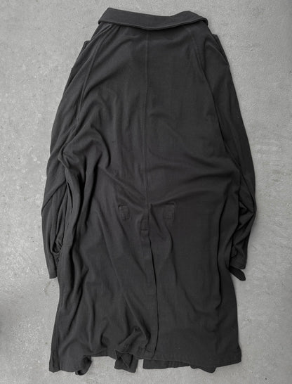 Black shirt on a gray textured surface