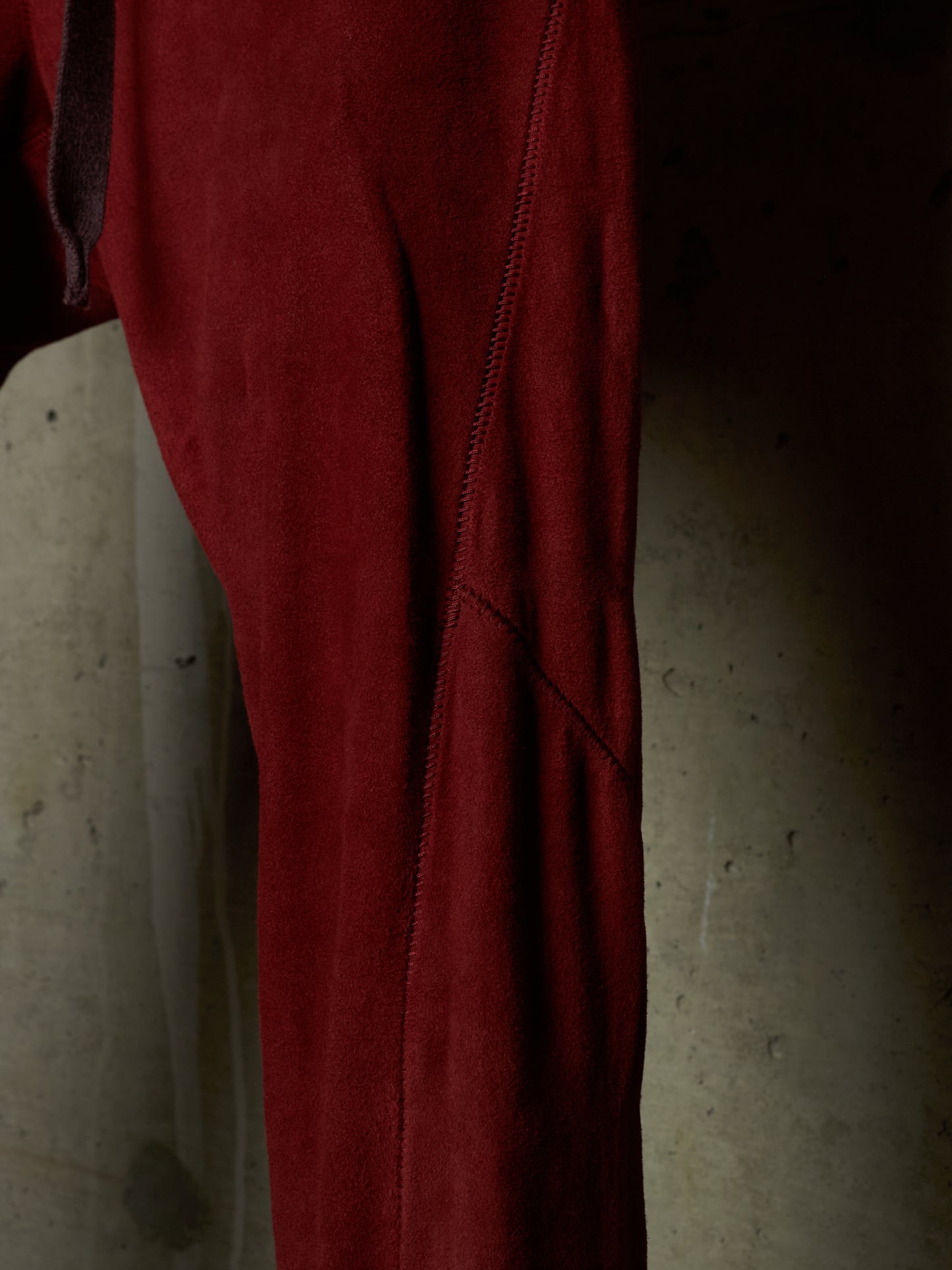 Isaac Sellam: “Experience” Brick Red Overlock Stretch Lambskin Suede Leather Jogging Pants