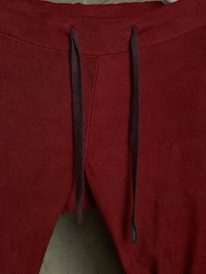 Isaac Sellam: “Experience” Brick Red Overlock Stretch Lambskin Suede Leather Jogging Pants