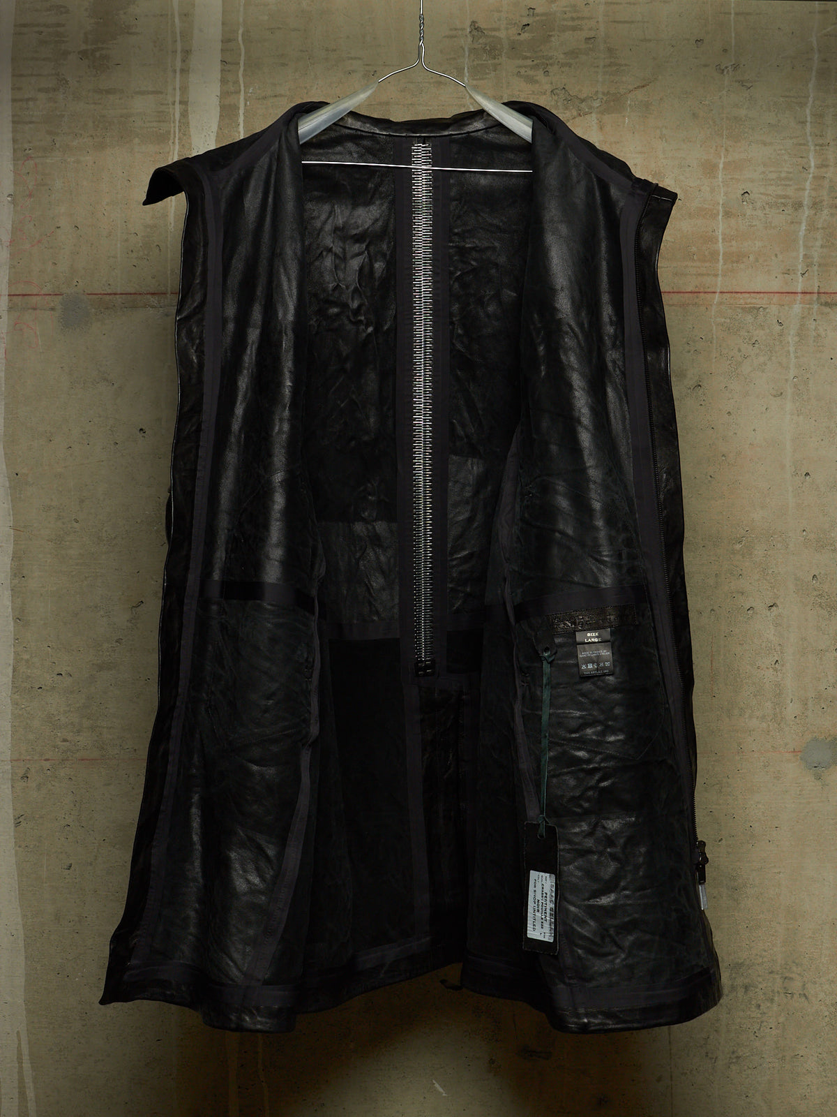 Isaac Sellam: “Experience” SS22 Black High Neck Pertinent Lambskin Leather Coat