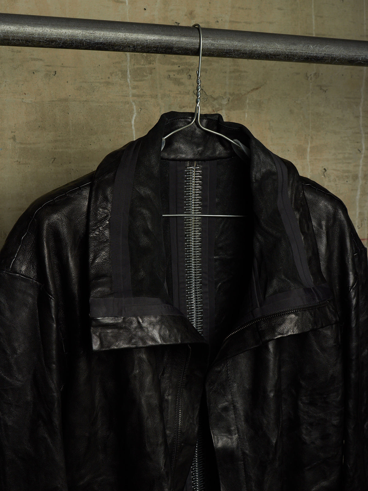 Isaac Sellam: “Experience” SS22 Black High Neck Pertinent Lambskin Leather Coat
