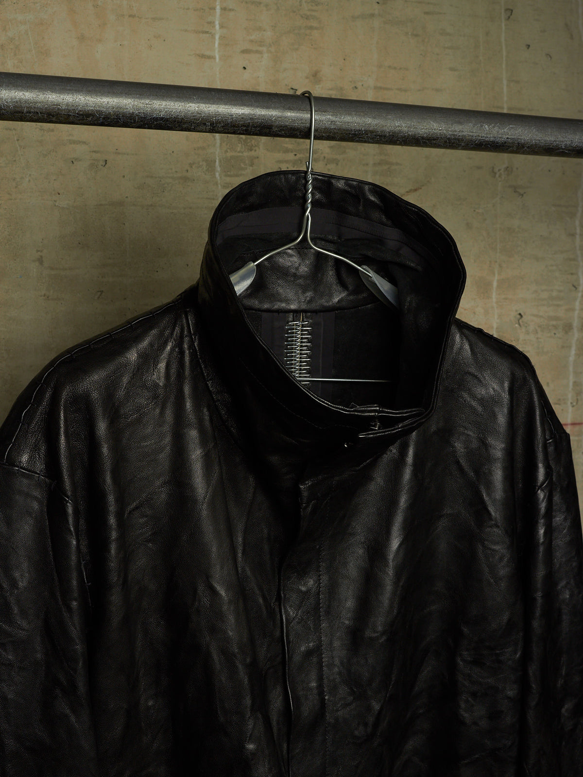 Isaac Sellam: “Experience” SS22 Black High Neck Pertinent Lambskin Leather Coat