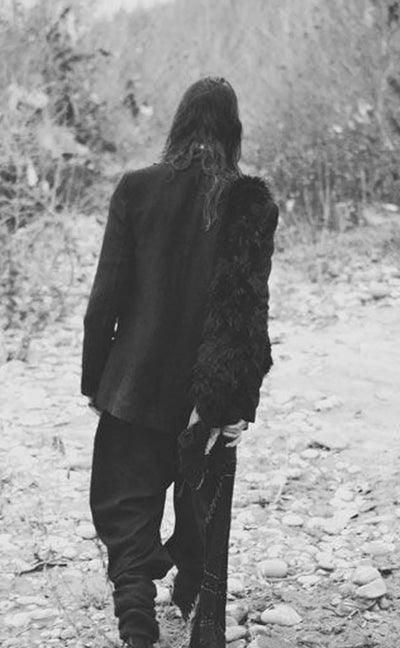 Isabel Benenato lookbook image in black and white — model facing away, showcasing minimalist tailoring