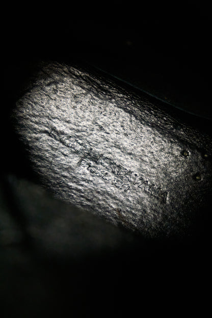 Close-up of a textured surface with 'Made in Italy' text on a dark background